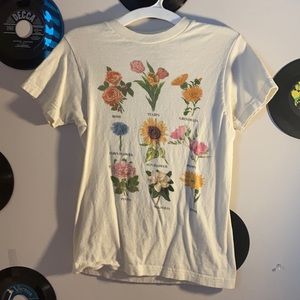 A creme colored tee with flowers